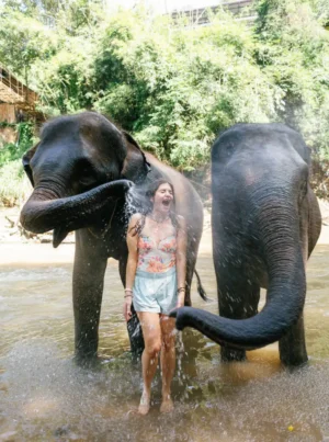 Kristina with two elephants